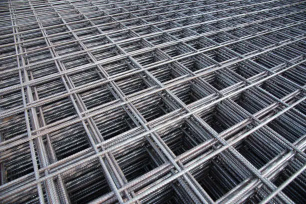 Photo of Steel bar iron wire in factory.Steel Rebars for reinforced concrete  construction site.Steel reinforcement bar for industrial building