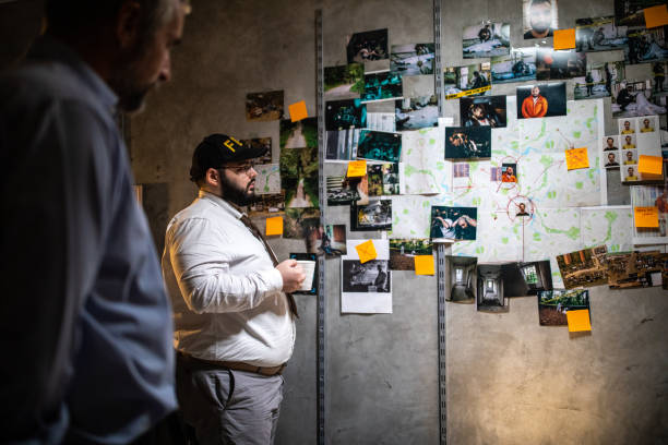 istock Police detectives working up late to solve the case 1205789258