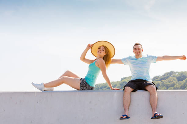 istock Man and woman sitting together outside 1205789344