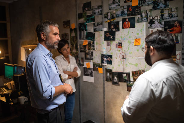 istock FBI team working together at office late at night to solve the case 1205789618