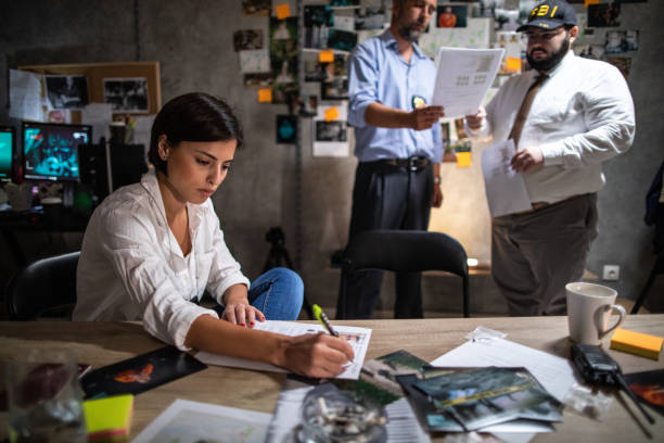 istock FBI detectives working hard late at night in office to solve murder case 1205789899
