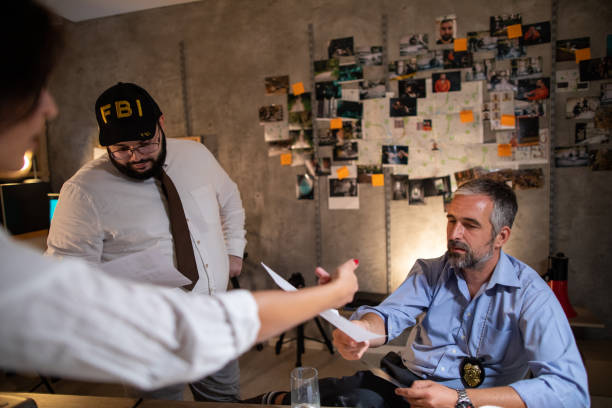 istock FBI detectives working hard late at night in office to solve murder case 1205789943