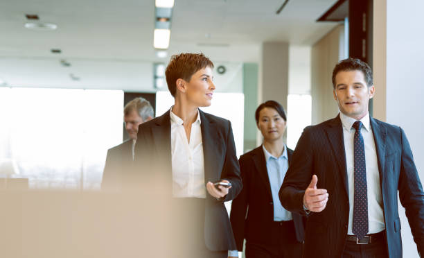 Colleagues Consulting In A Looby