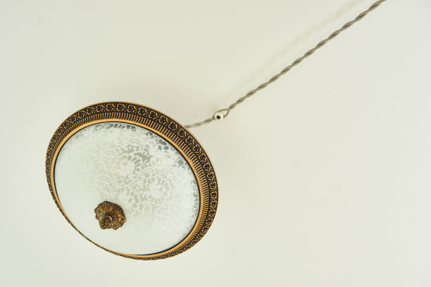 istock Circular vintage plafond lamp with electrical wiring. Background, copy space 1205790140