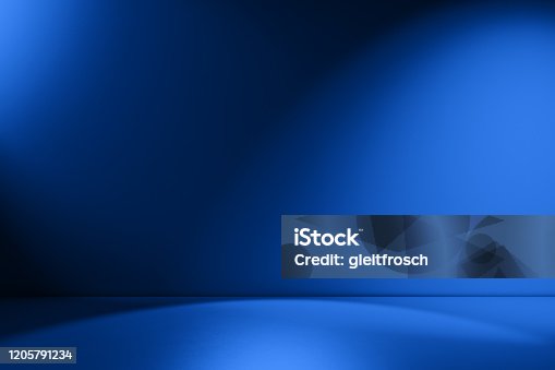 istock Beams of spotlight on a royal blue background 1205791234