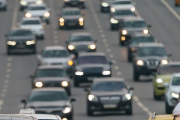 Defocused photography of big traffic in day time Defocused photography of big traffic on the city street. Road if filled out by cars. Rush hours. Bright lifestyles of big city concepts. Soft gray colors and background. High angle view. Frontal view. russia city spring stock pictures, royalty-free photos & images