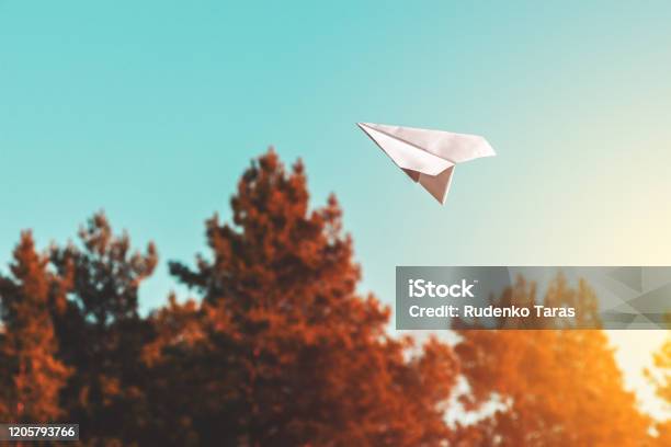 White Paper Airplane In The Air Stock Photo - Download Image Now - Paper Airplane, Sky, Flying