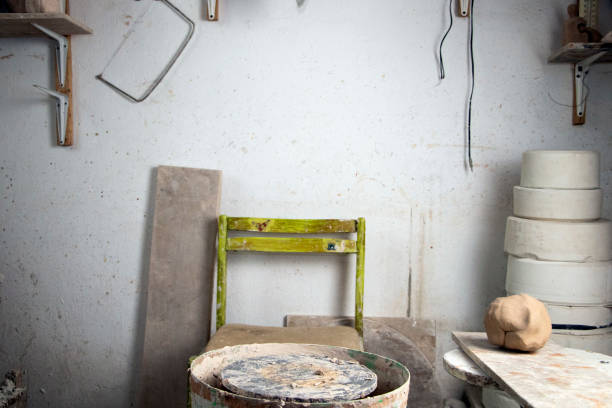 istock Potter's workplace. Old traditional art, handmade, clay and ceramic production. 1205794095