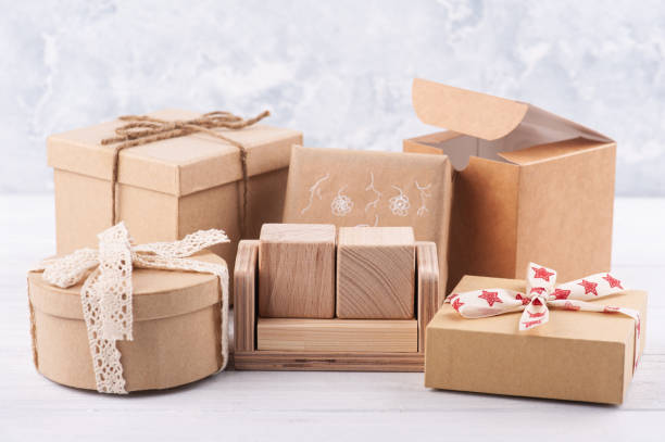 istock Empty blank wooden calendar and kraft gift boxes 1205796619