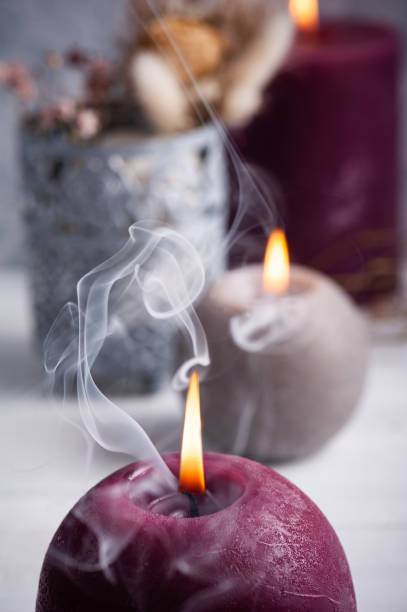istock Red marsala aroma candle fuming 1205796804