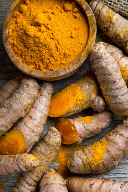 istock Curcuma longa, powder and rhizomes 1205797087