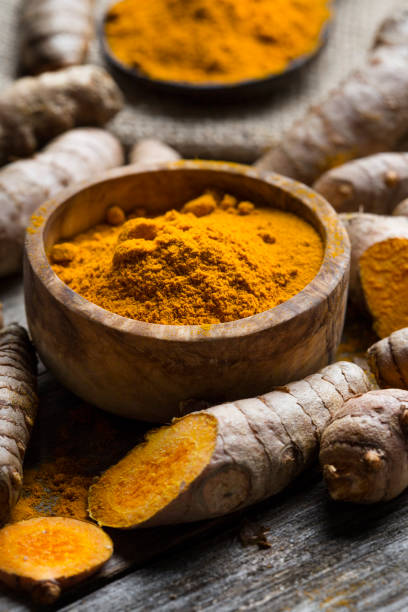 istock Curcuma longa, powder and rhizomes 1205797318