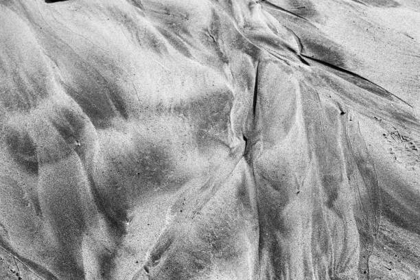 istock Abstract Image of Sea Sand Formed After Tide 1205799789