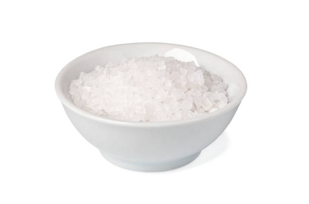 istock bowl of salt on white background 1205801670