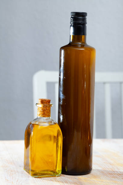 istock Vegetable oil on wooden table 1205802558