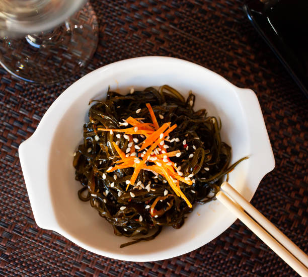 istock Japanese dish - seaweed salad with sesame seeds 1205803511