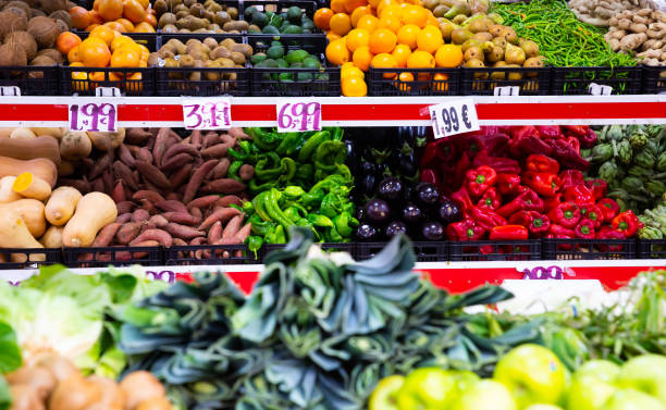 istock Market counter with fresh fruits and vegetables 1205803686