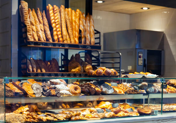 istock Bakery shop with assortment of bread on shelves 1205803790
