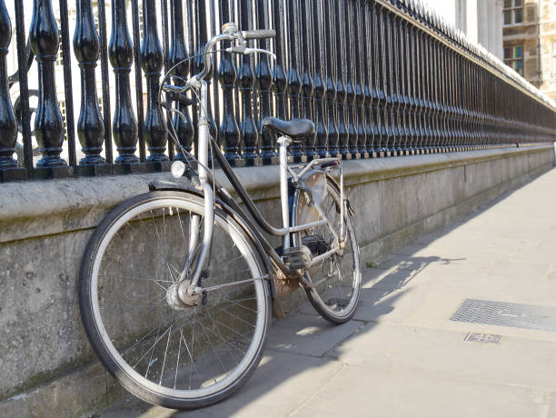 istock Student bicycle rests against a fence 1205805791