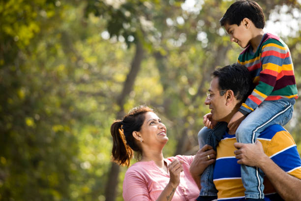 istock Happy family at park 1205807294