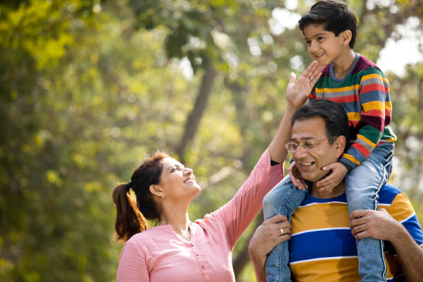 istock Happy family at park 1205807330