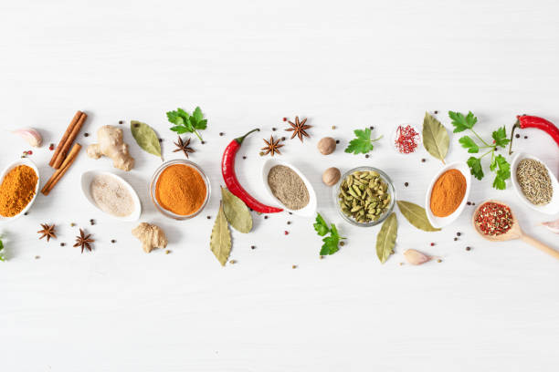 istock Various assorted colorful spices and herbs on white wooden background top view. 1205807497