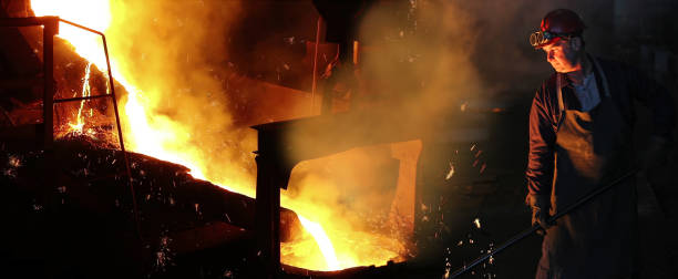 istock Worker controlling iron smelting in furnaces 1205809055