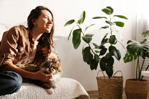 istock Charismatic young woman playing with her adorable cat. 1205810654