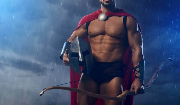 istock Fit spartan archer holding helmet. 1205810704