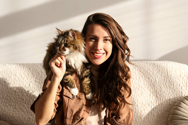 istock Charismatic young woman playing with her adorable cat. 1205810817