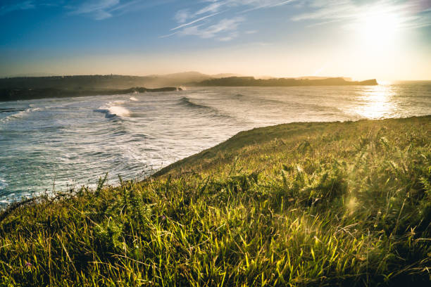 istock Sunset in Bahia de Suances with waves and wind, Spain 1205811044