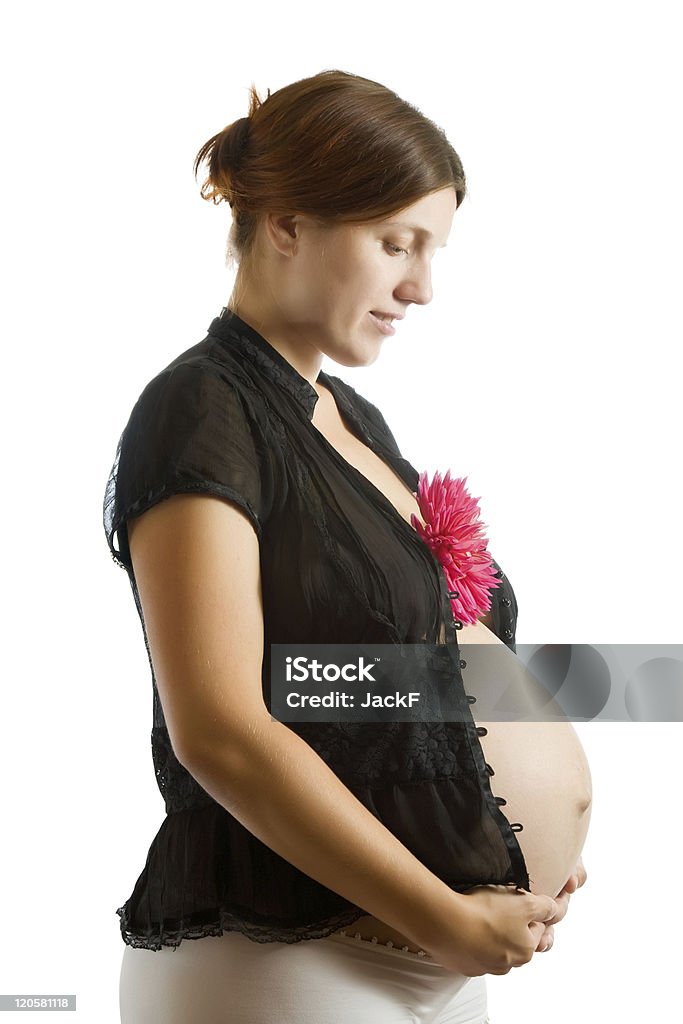 pregnant woman holding  flower Portrait of pregnant woman holding  flower over white Pregnant Stock Photo