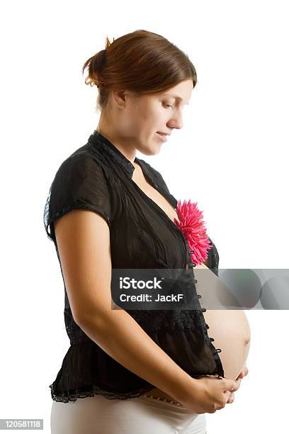 Pregnant Woman Holding Flower Stock Photo - Download Image Now - Pregnant, Abdomen, Adult