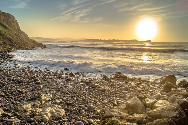 istock Sunset in Bahia de Suances with waves and wind, Spain 1205812075