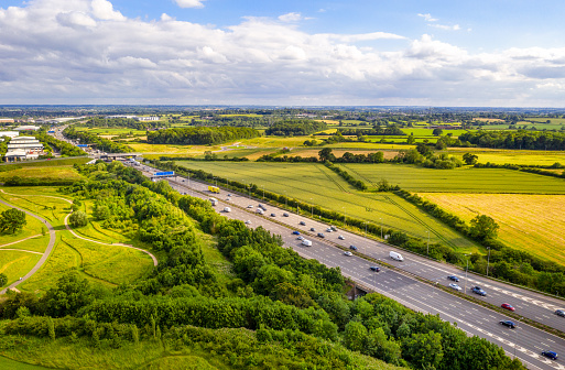 An aerial view of daytime traffic on the M1 near Lancaster on a sunny summer's day.