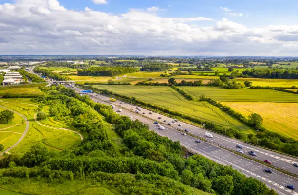An aerial view of daytime traffic on the M1 near Lancaster on a sunny summer's day.