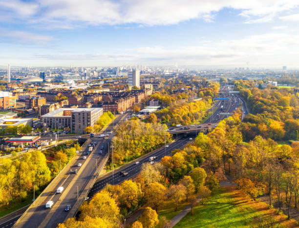 Glasgow's cityscape in autumn The Southside and central part of the city of Glasgow photographed from the air during autumn, with motorways in the foreground. glasgow scotland stock pictures, royalty-free photos & images