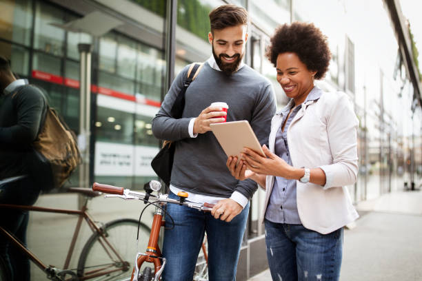 istock Business people talking outside with coffee, break relaxing time concept. 1205812793