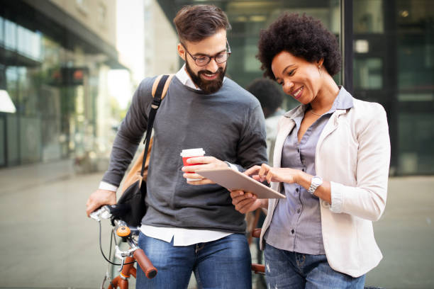 istock Business people talking outside with coffee, break relaxing time concept. 1205812841