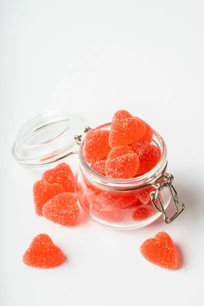 Photo of A jar full of red jelly candy hearts