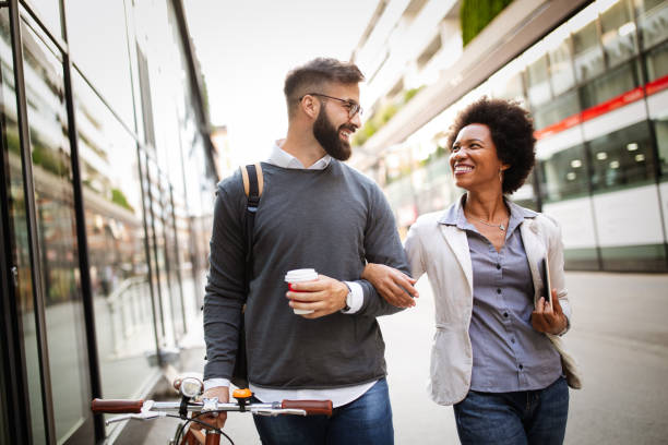 istock Business people talking outside with coffee, break relaxing time concept. 1205813369