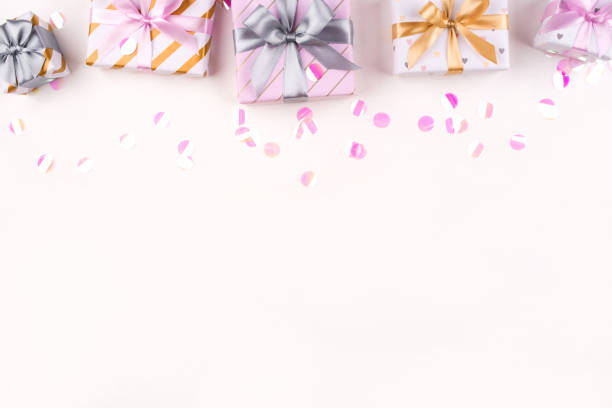 istock Set of gift boxes with bows and confetti on a white background. 1205813890