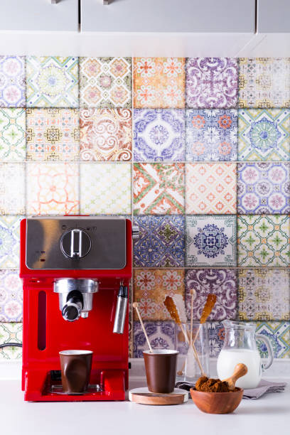 istock Home espresso machine on kitchen countertop with two cups, milk and sugar on sticks. Making coffee at home. 1205814365