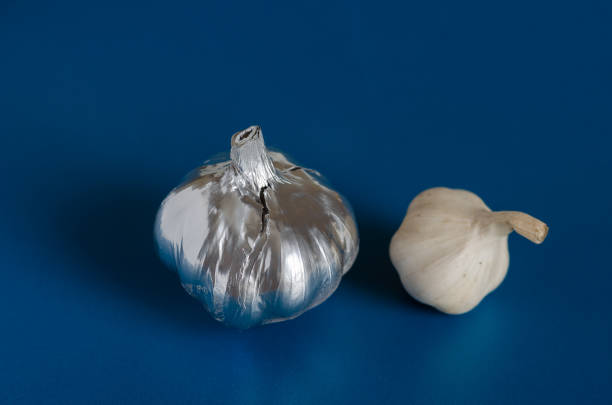 istock Head of garlic painted with silver paint. 1205817237