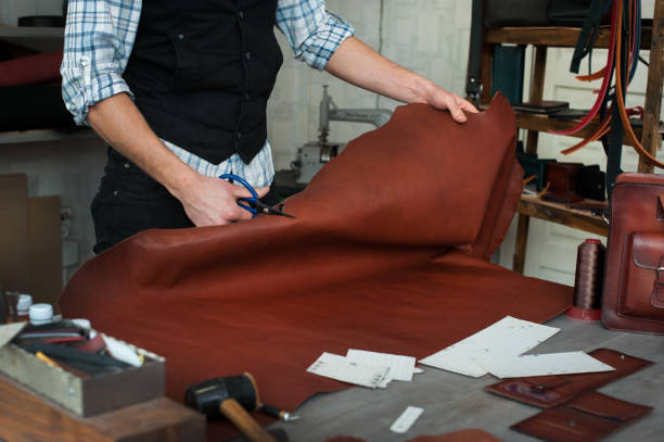istock Master sewing leather goods, concept of handmade craft production 1205821499
