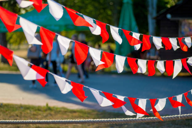 istock red and white garland flags hanging outdoors 1205821776