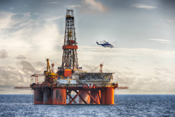 istock Chopper landing on a oil rig at day 1205822928