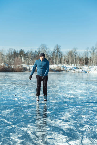 istock A young man skates on a frozen lake. 1205823466