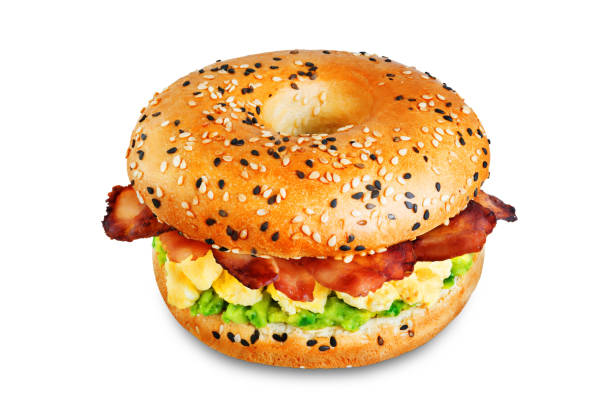 istock Fried bacon avocado cheese egg salad  bagel on a white isolated background 1205823612