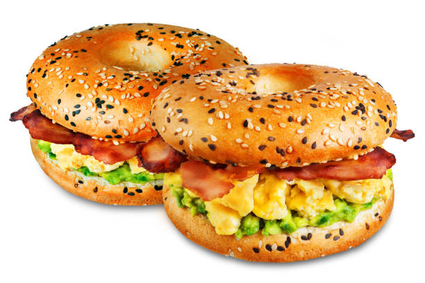 istock Fried bacon avocado cheese egg salad  bagel on a white isolated background 1205823628